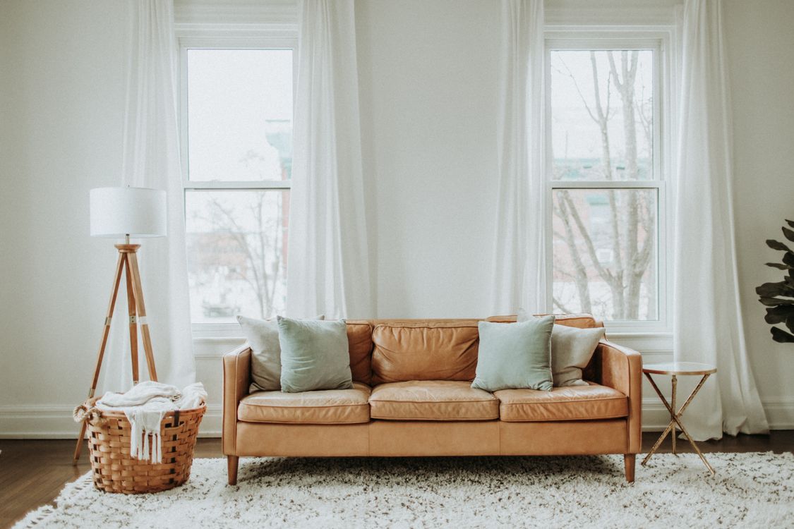 Free White and Brown Sofa Chair Near White Window Curtain Stock Photo