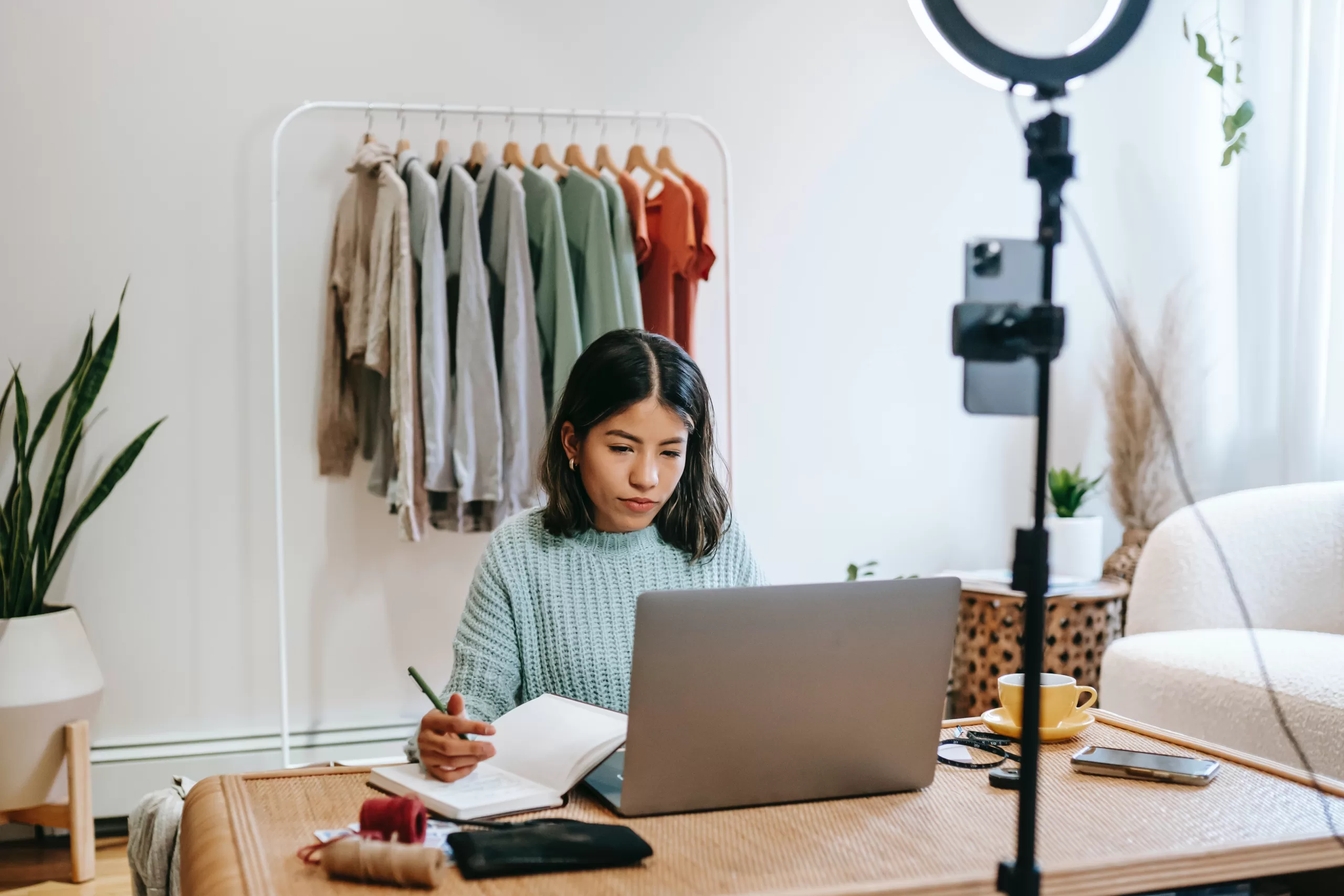 blogger writing content on laptop