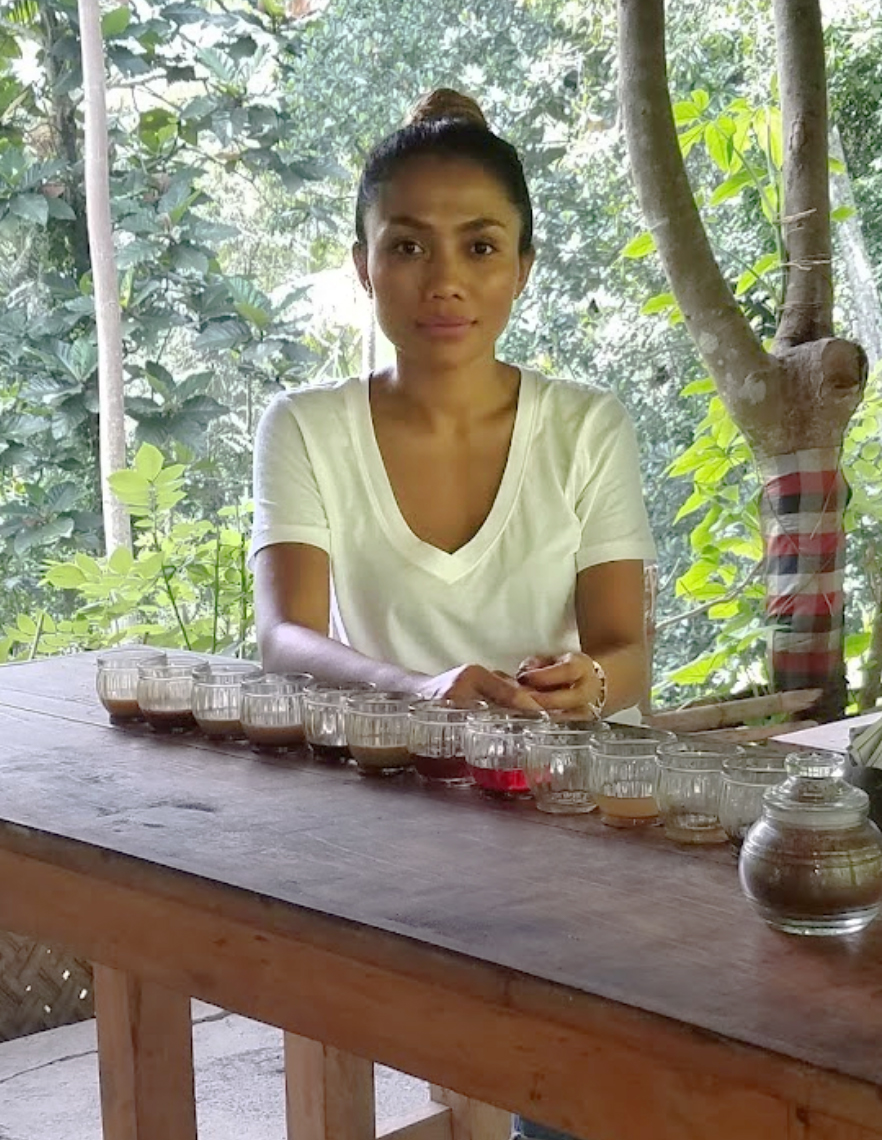 Hanna, founder of bali espresso, at a coffee tasting table in Bali