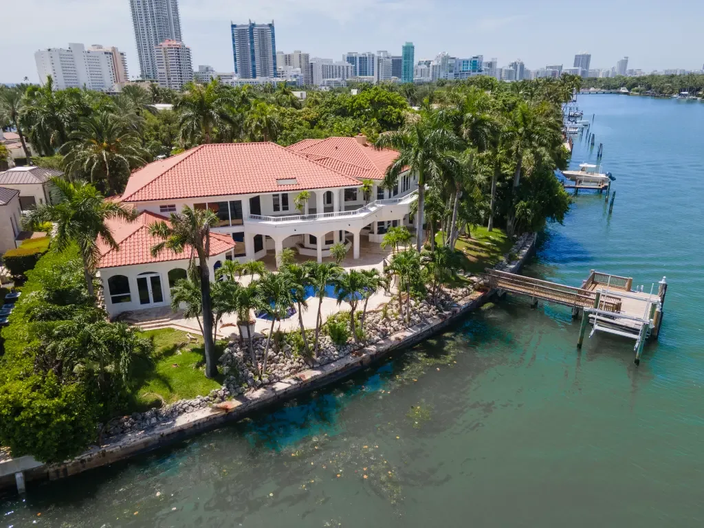 An aerial view of a waterfront estate on a Miami island