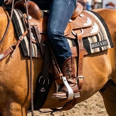 Tooled Western reining saddle with a Bridle & Bay saddle pad