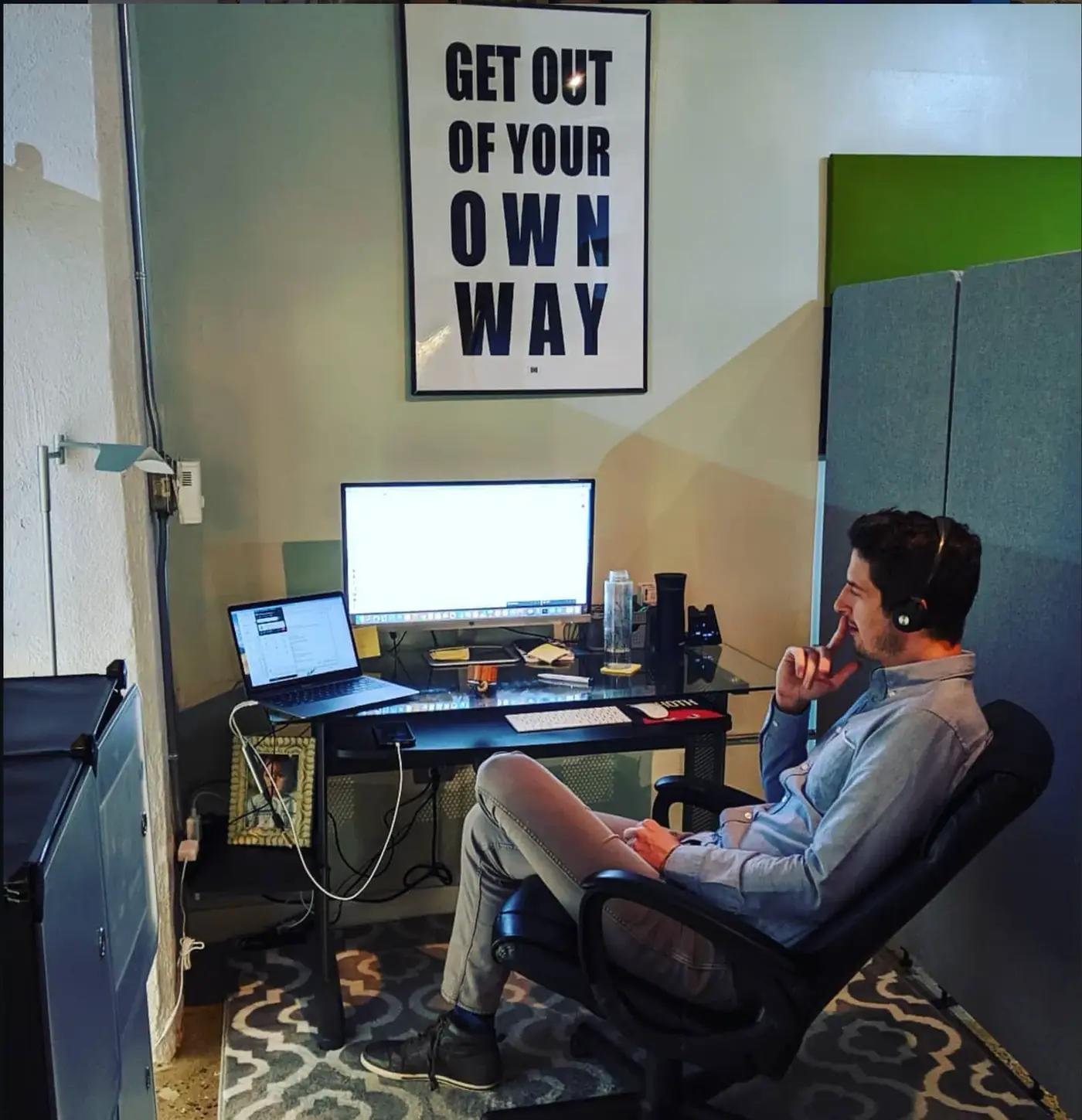 A developer working at a desk in an office