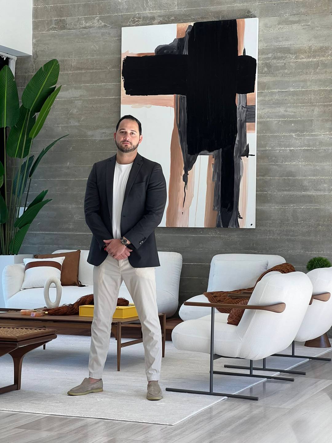 Jonathan Bigelman standing in a contemporary Miami living room