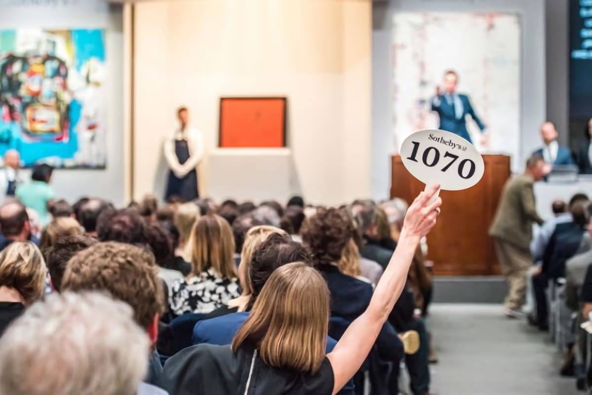 A bidder raises paddle 1070 during a sale in a Sotheby's saleroom