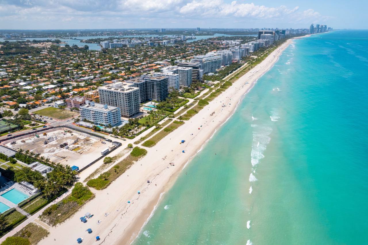 Aerial view of oceanfront condominium towers along the beach
