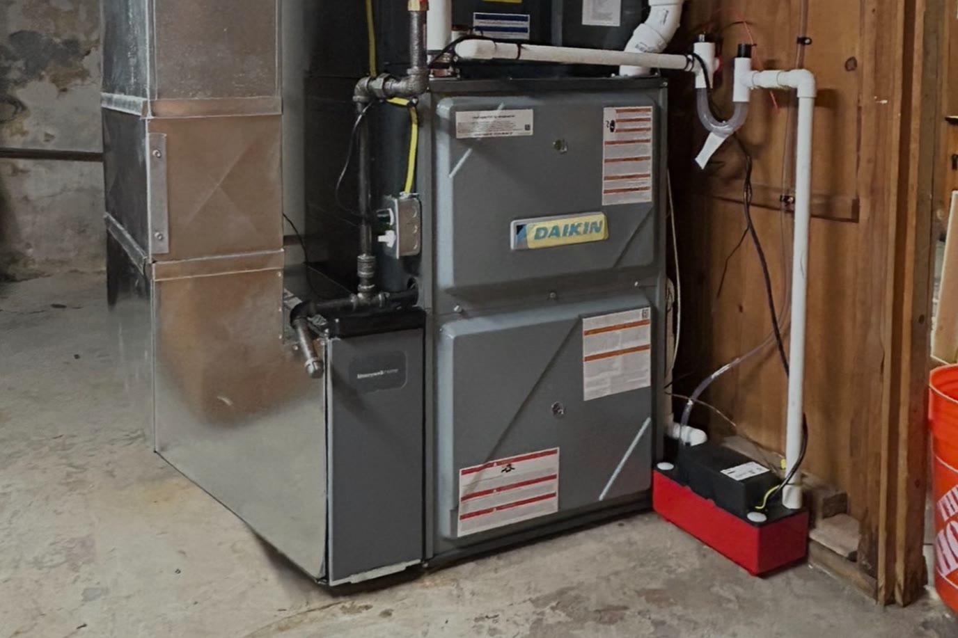 High-efficiency Daikin gas furnace installed in a basement utility room