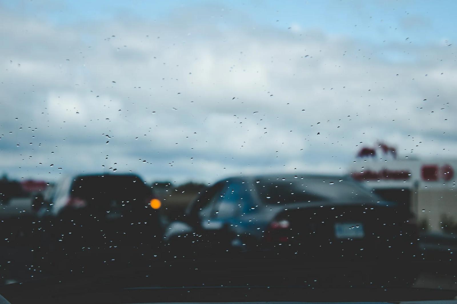 Traffic seen through a rainy windshield